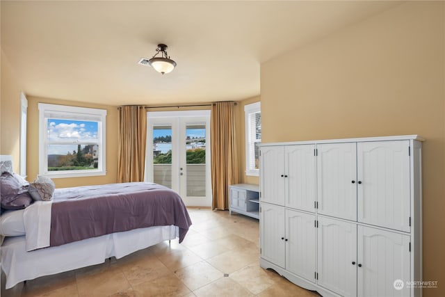 bedroom with access to exterior and french doors