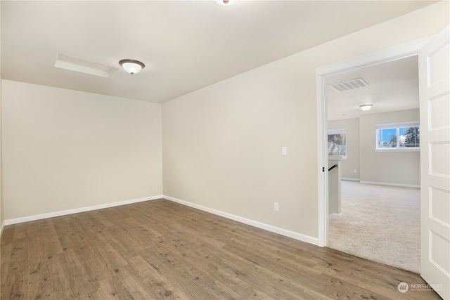 spare room with hardwood / wood-style floors