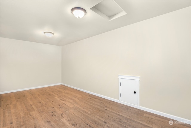 empty room with hardwood / wood-style flooring