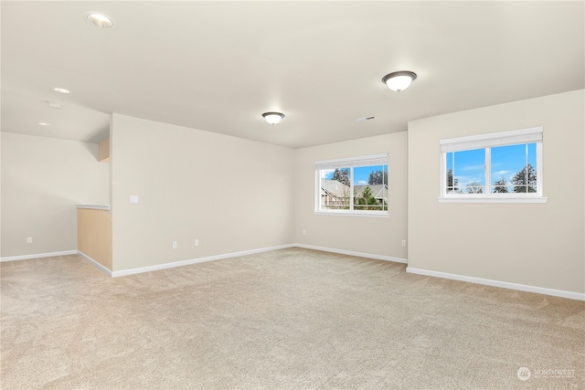 spare room with light colored carpet