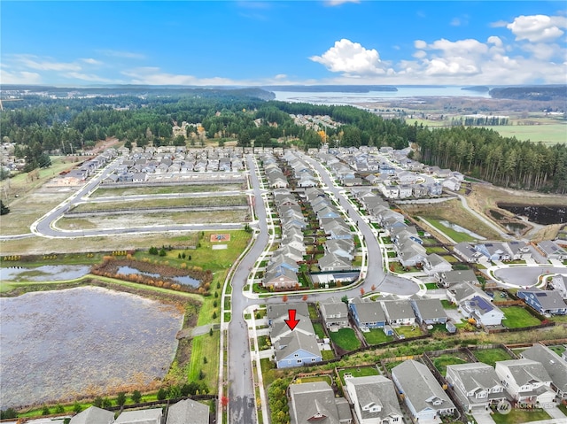 bird's eye view with a water view