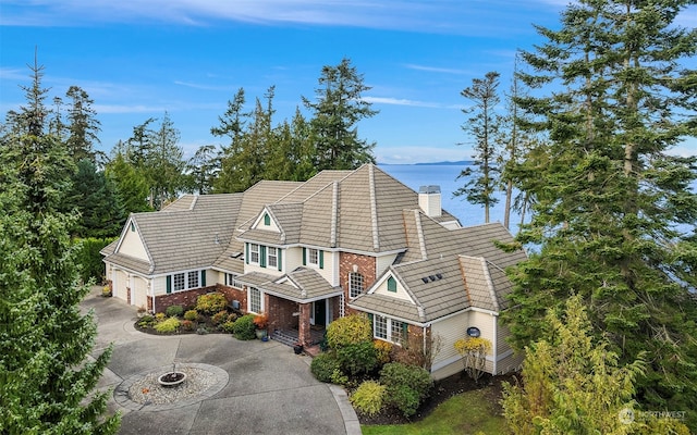 view of front of house featuring a water view and a garage