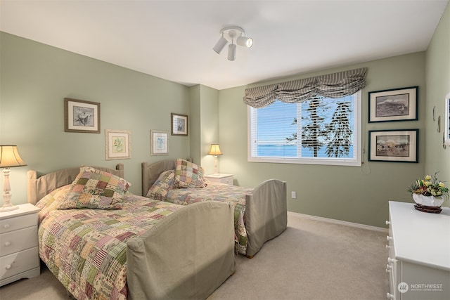 bedroom with light colored carpet