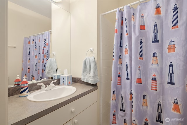 bathroom with a shower with shower curtain and vanity