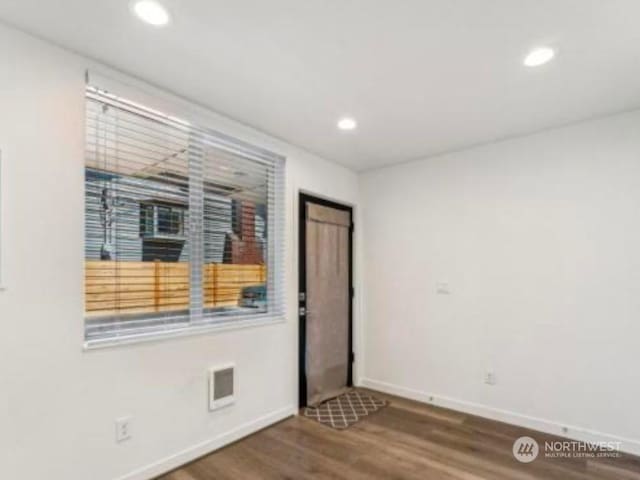 spare room featuring hardwood / wood-style floors