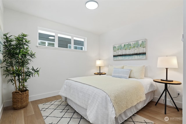 bedroom with light wood-type flooring