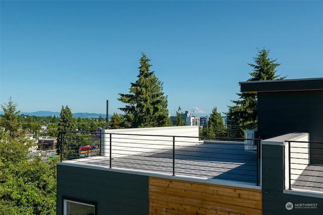 exterior space featuring a mountain view and a balcony