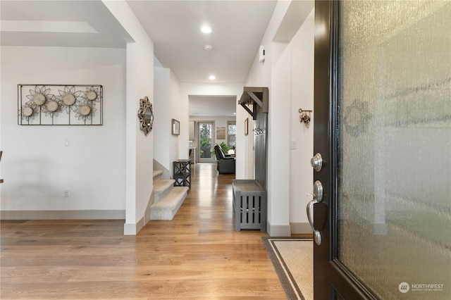 foyer with light hardwood / wood-style floors