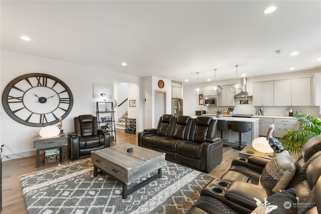 living room with light hardwood / wood-style flooring