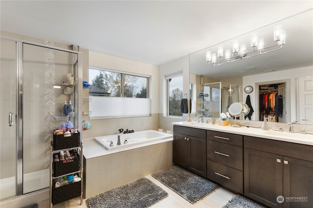 bathroom with vanity and separate shower and tub