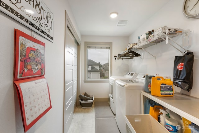 laundry room featuring washing machine and dryer