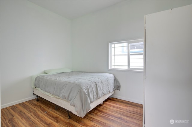 bedroom featuring hardwood / wood-style flooring