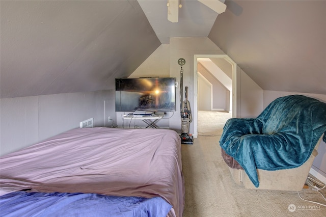 carpeted bedroom with ceiling fan and lofted ceiling