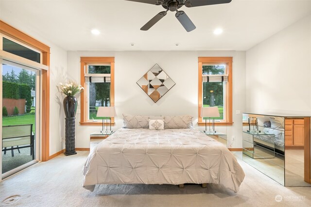 bedroom featuring access to outside, ceiling fan, and light carpet