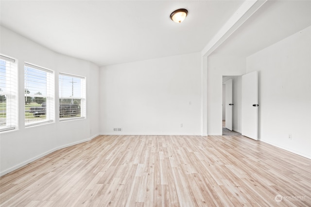 unfurnished room with light hardwood / wood-style flooring