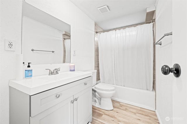 full bathroom featuring shower / bathtub combination with curtain, vanity, toilet, and wood-type flooring