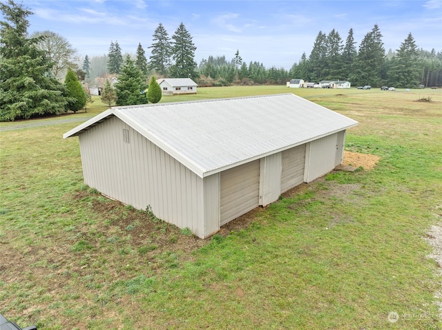 view of outdoor structure with a lawn