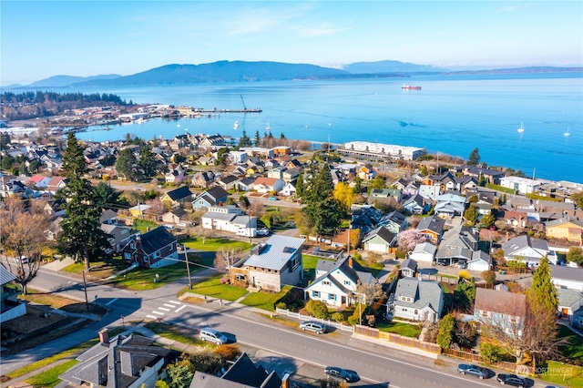 aerial view featuring a water and mountain view