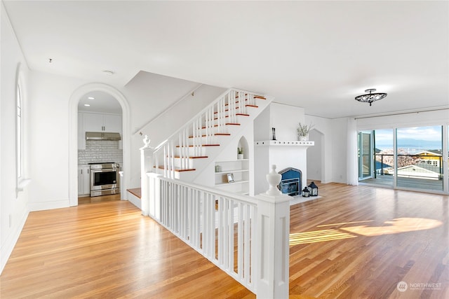 stairs with wood-type flooring