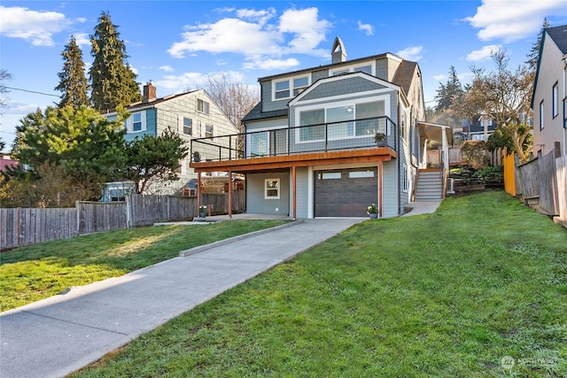 view of front of property with a front lawn and a garage