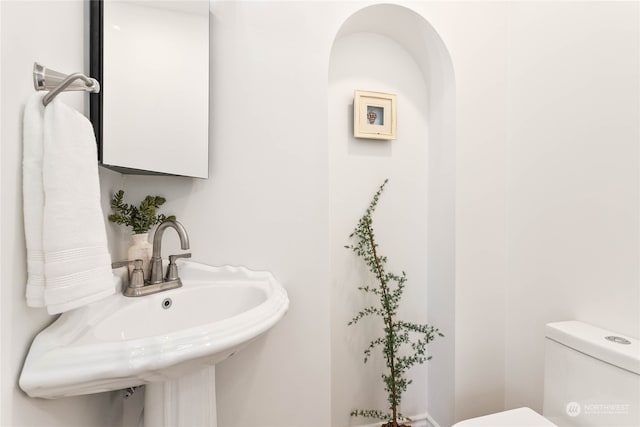 bathroom with sink and toilet