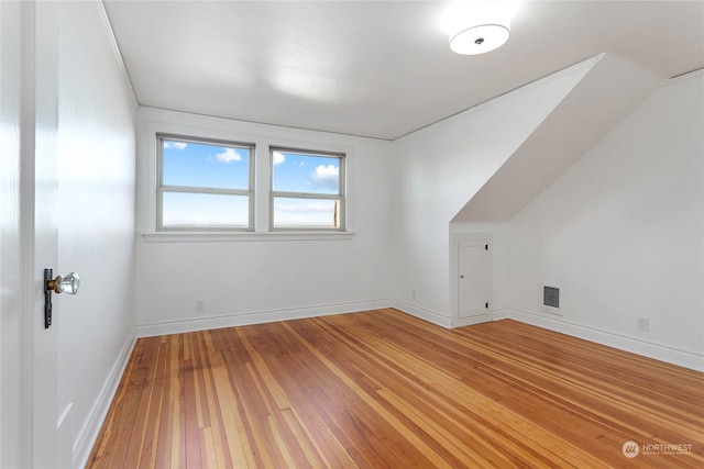 bonus room with wood-type flooring