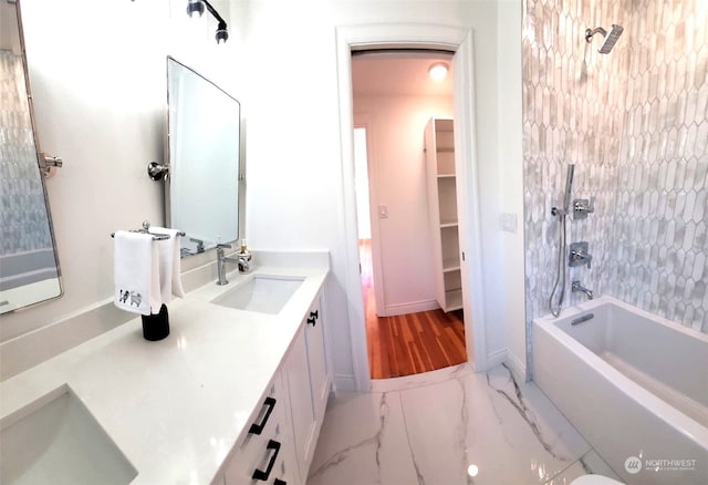 bathroom featuring vanity and tub / shower combination