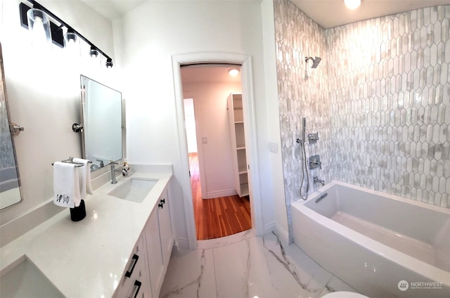 bathroom featuring vanity and shower / bath combination