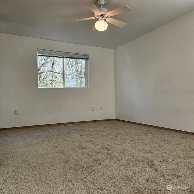 carpeted empty room with ceiling fan