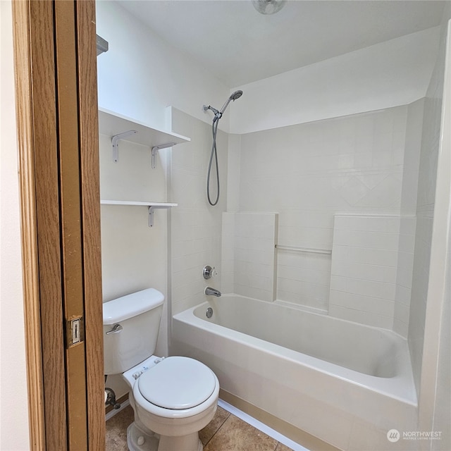 bathroom with tile patterned flooring, toilet, and washtub / shower combination