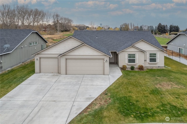 805 S Hamilton Rd, Moses Lake, WA 98837 - view of front of home with an attached garage, concrete driveway, a front lawn, and a shingled roof