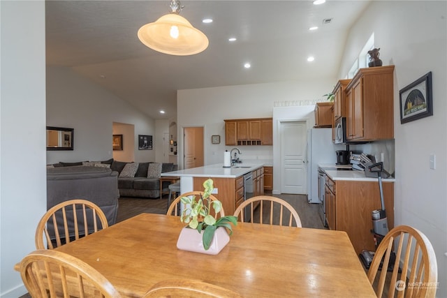 805 S Hamilton Rd, Moses Lake, WA 98837 - dining room with lofted ceiling, recessed lighting, and dark wood-type flooring