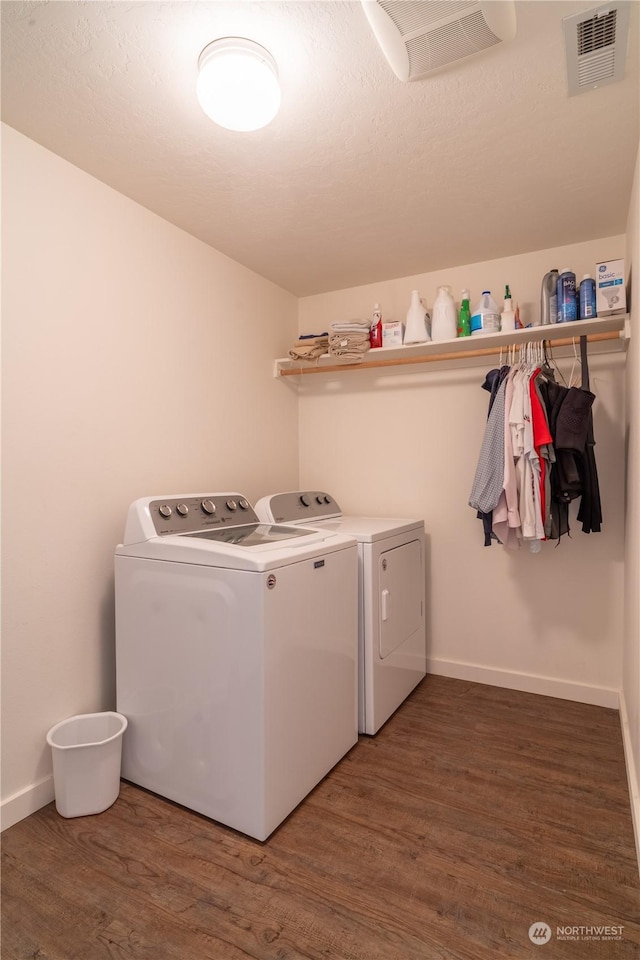 805 S Hamilton Rd, Moses Lake, WA 98837 - laundry room with washer and clothes dryer, wood finished floors, baseboards, and a textured ceiling