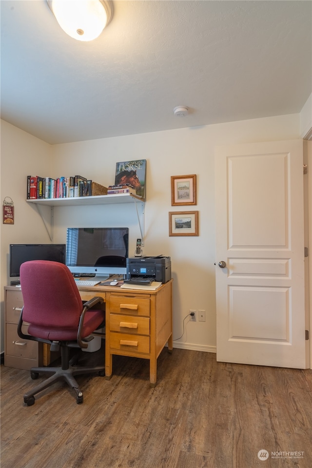 office space with dark hardwood / wood-style flooring