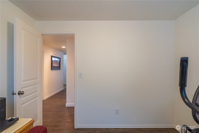 workout area featuring dark wood-type flooring