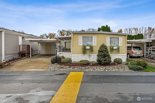 manufactured / mobile home featuring a carport