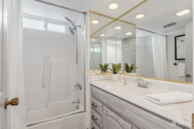 bathroom with vanity and shower / tub combo with curtain