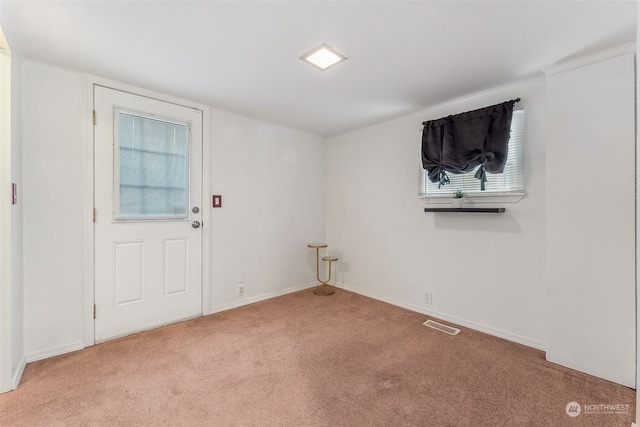 interior space featuring light colored carpet