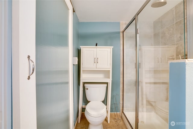 bathroom featuring tile patterned flooring, an enclosed shower, and toilet