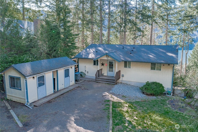 ranch-style home with a front lawn