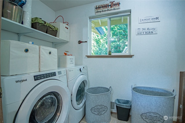 laundry area with washing machine and clothes dryer