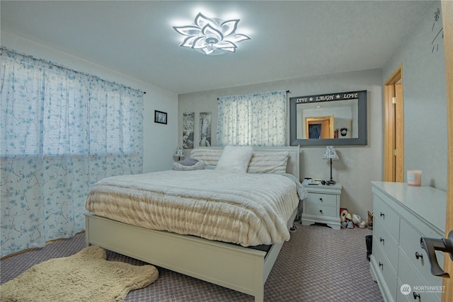 bedroom featuring carpet