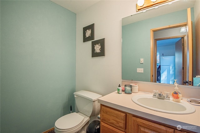 bathroom with vanity and toilet