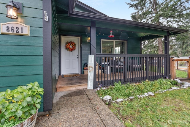 entrance to property with covered porch