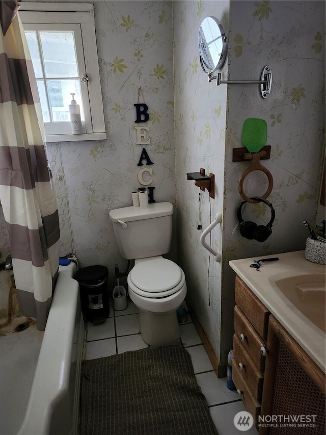 full bath featuring wallpapered walls, toilet, vanity, and tile patterned flooring