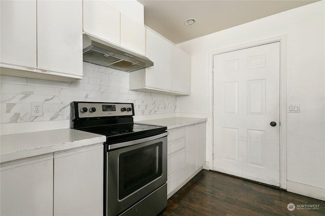 kitchen featuring stainless steel range with electric stovetop, dark wood-type flooring, ventilation hood, tasteful backsplash, and white cabinetry