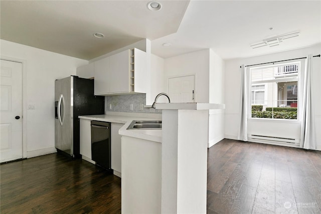 kitchen featuring black dishwasher, dark hardwood / wood-style floors, a baseboard heating unit, kitchen peninsula, and white cabinets