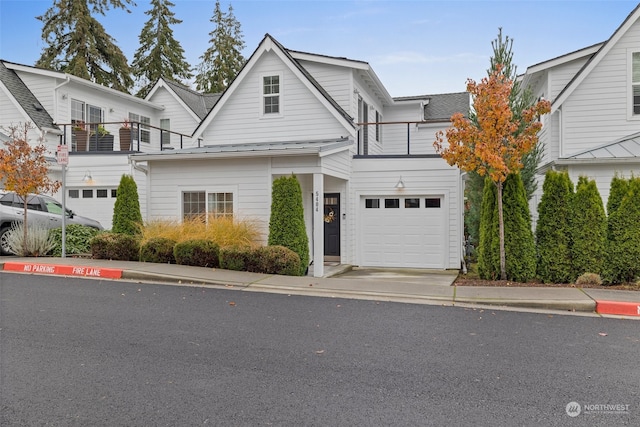 front of property featuring a garage and a balcony