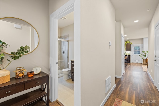 hallway featuring dark wood-type flooring