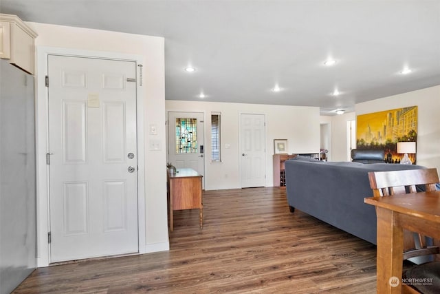 living room with dark hardwood / wood-style flooring